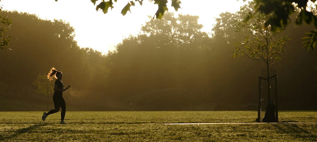 woman playing soccer in park